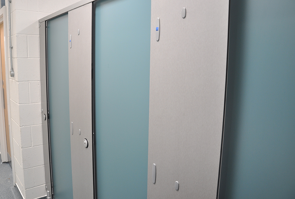 row of toilet cubicles by cubicle centre at Keswick rugby club